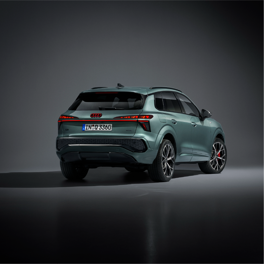 Rear image of blue green 2026 Audi Q3 tail lights